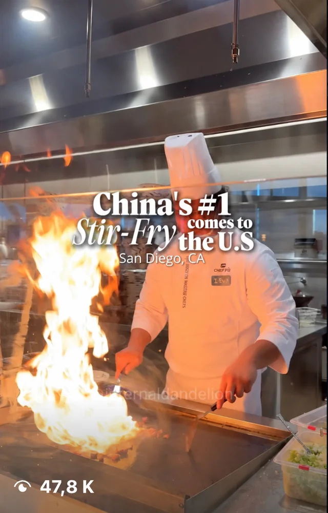 internaldandelion's post: "China's #1 stir-fry comes to the U.S.", a chef over a wall of flame
