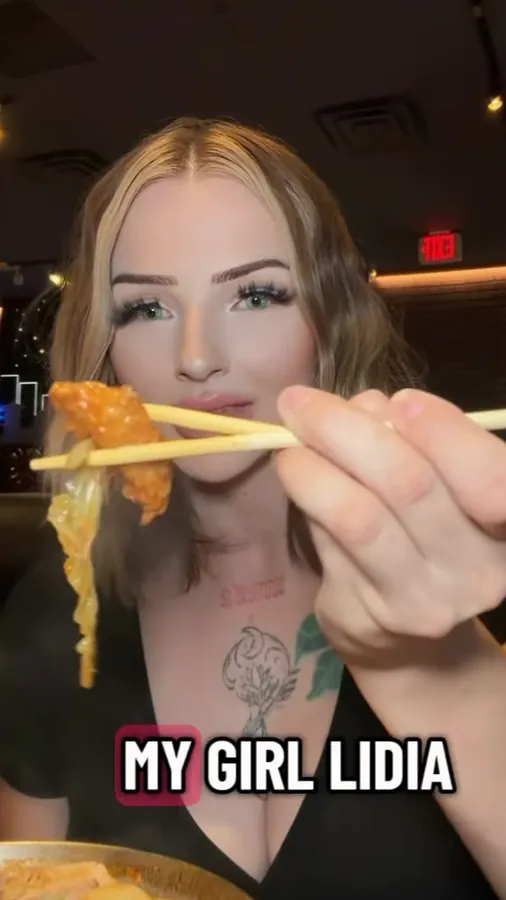 A creator holding up a bite of food with chopsticks over a bowl, from a reel by @munchies.moira